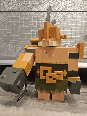Blocky Viking Figure Toy with Orange Helmet and Green Belt